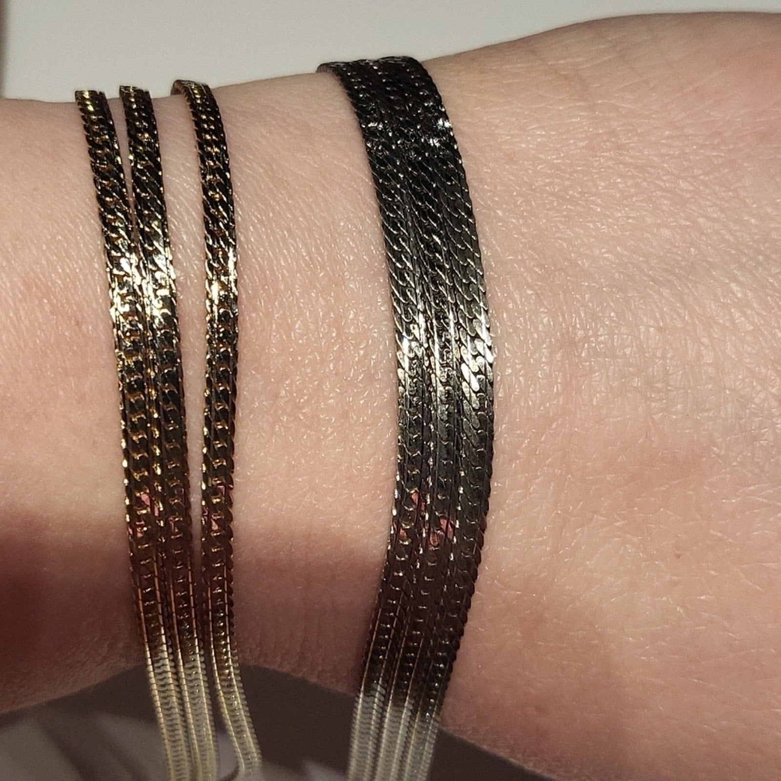 Set of 2 triple strand fashion bracelets in silver and gold